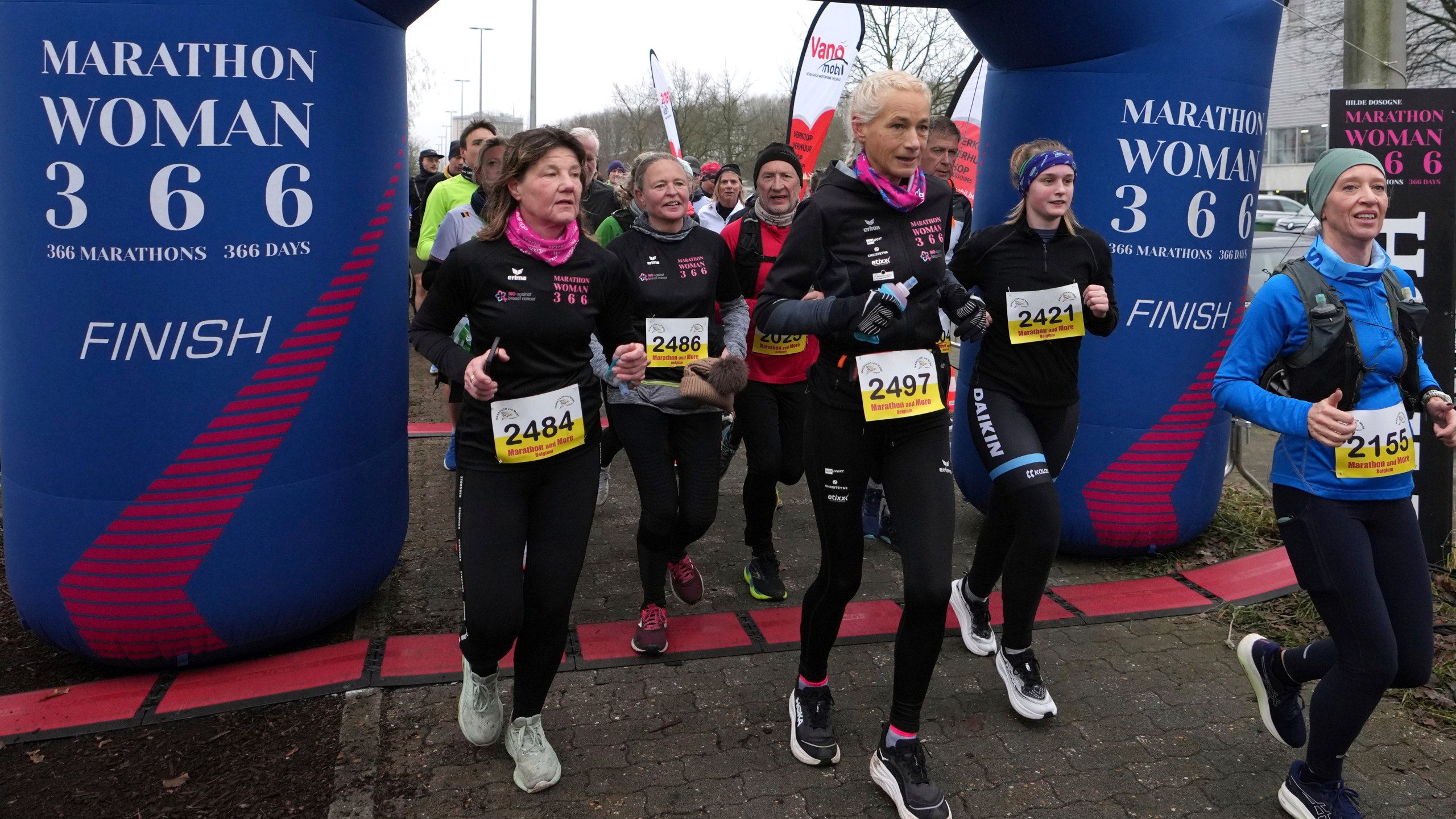 Belgian ultra runner Hilde Dosogne, center, runs during her 366th consecutive marathon in Ghent, Belgium, Tuesday, Dec. 31, 2024. (AP Photo/Virginia Mayo)