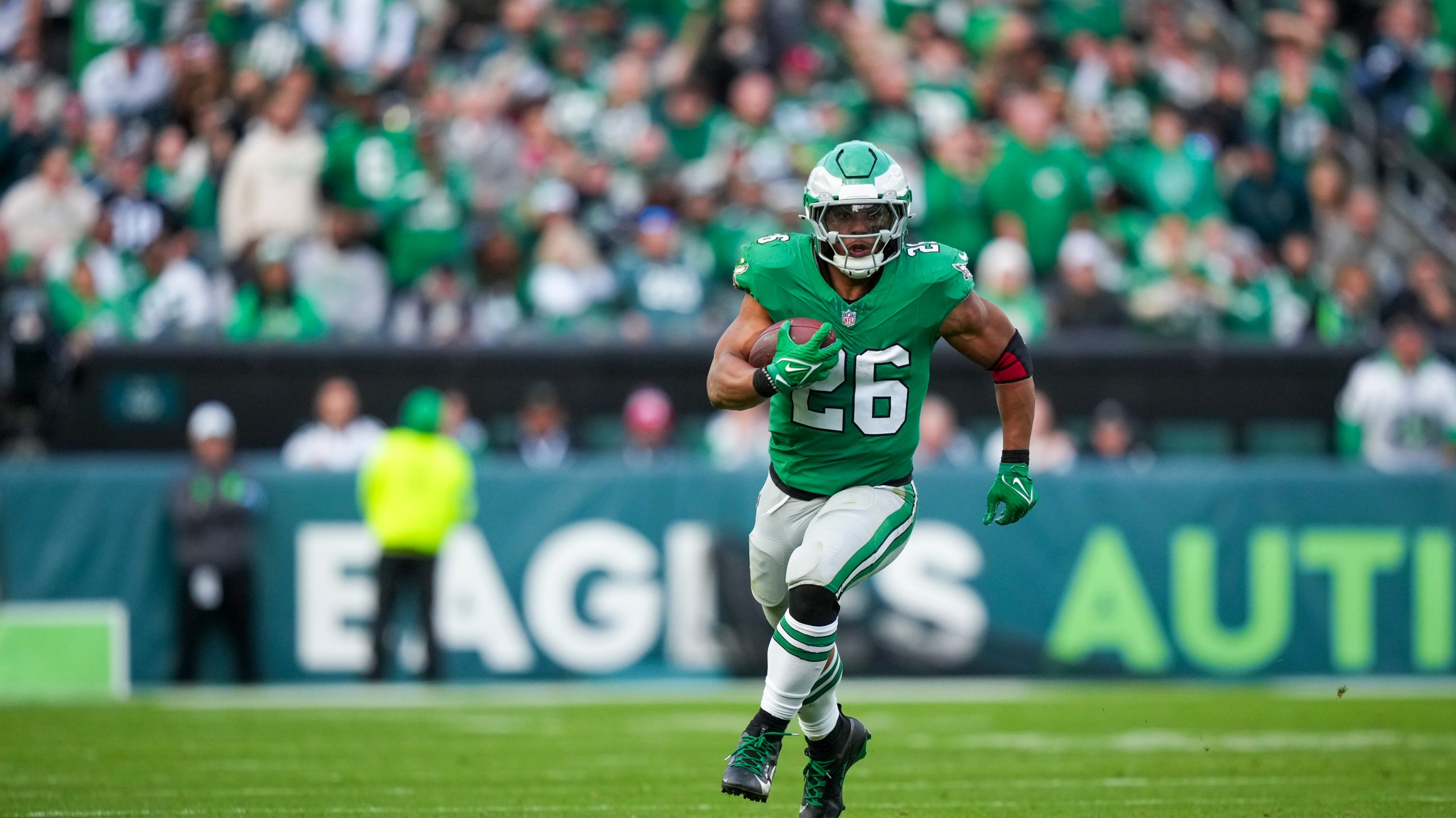 Philadelphia Eagles running back Saquon Barkley (26) runs the ball against the Dallas Cowboys during the second half of an NFL football game, Sunday, Dec. 29, 2024, in Philadelphia. (AP Photo/Matt Slocum)