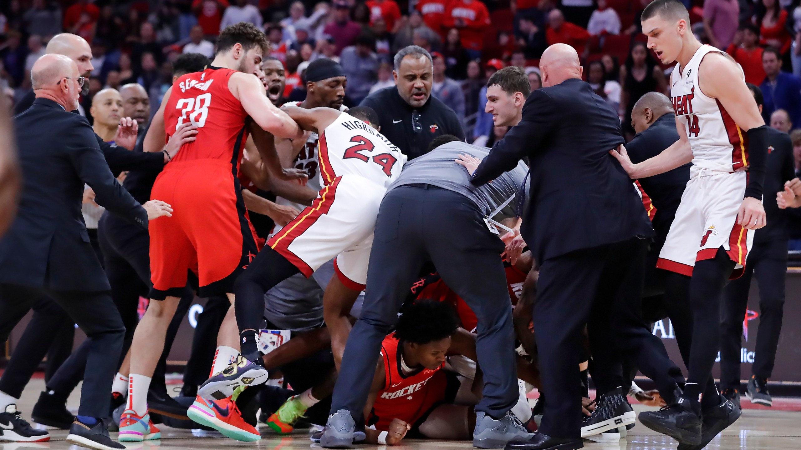 Both bench clear for a brawl after Houston Rockets forward Amen Thompson threw Miami Heat guard Tyler Herro to the court, resulting in multiple ejections for both teams in the final minute of play during the second half of an NBA basketball game Sunday, Dec. 29, 2024, in Houston. (AP Photo/Michael Wyke)