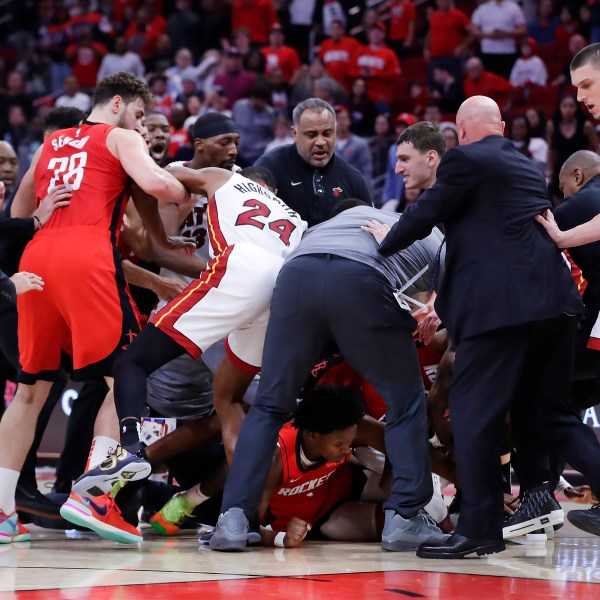 Both bench clear for a brawl after Houston Rockets forward Amen Thompson threw Miami Heat guard Tyler Herro to the court, resulting in multiple ejections for both teams in the final minute of play during the second half of an NBA basketball game Sunday, Dec. 29, 2024, in Houston. (AP Photo/Michael Wyke)