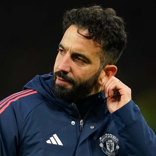 Manchester United's head coach Ruben Amorim pulls on his ear after the English Premier League soccer match between Manchester United and Bournemouth at the Old Trafford stadium in Manchester, England, Sunday, Dec. 22, 2024. (AP Photo/Dave Thompson)