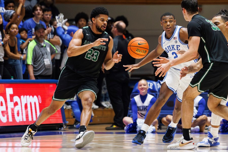 FILE - Dartmouth's Robert McRae III (23) takes a pass from Jackson Munro (33) as Duke's Jaylen Blakes (2) defends during the second half of an NCAA college basketball game in Durham, N.C., Monday, Nov. 6, 2023. (AP Photo/Ben McKeown, File)