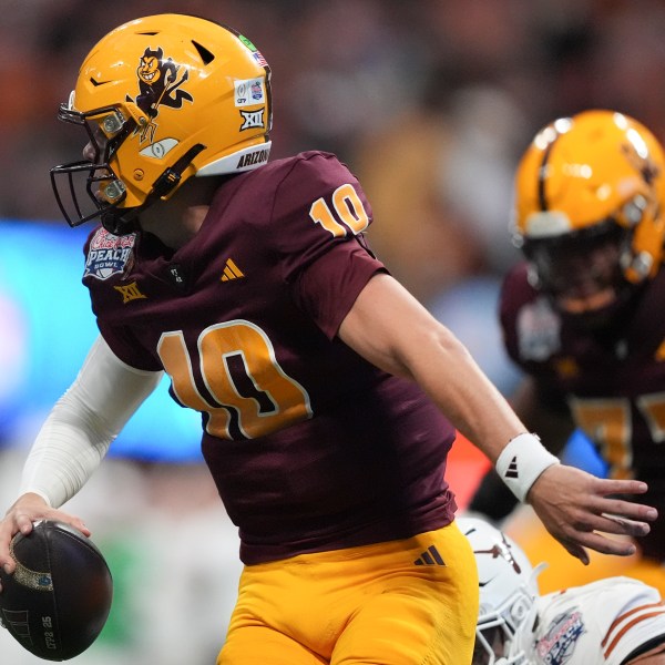 Arizona State quarterback Sam Leavitt (10) runs out of the pocket against Texas during the first half in the quarterfinals of a College Football Playoff, Wednesday, Jan. 1, 2025, in Atlanta. (AP Photo/Brynn Anderson)