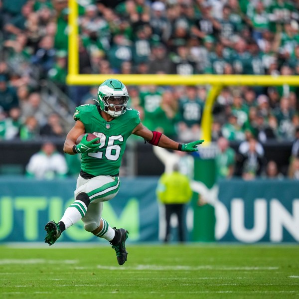 Philadelphia Eagles running back Saquon Barkley (26) runs the ball against the Dallas Cowboys during the second half of an NFL football game, Sunday, Dec. 29, 2024, in Philadelphia. (AP Photo/Matt Slocum)