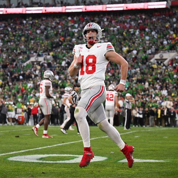 Ohio State quarterback Will Howard (18) reacts after a touchdown against Oregon during the second half in the quarterfinals of the Rose Bowl College Football Playoff, Wednesday, Jan. 1, 2025, in Pasadena, Calif. (AP Photo/Kyusung Gong)