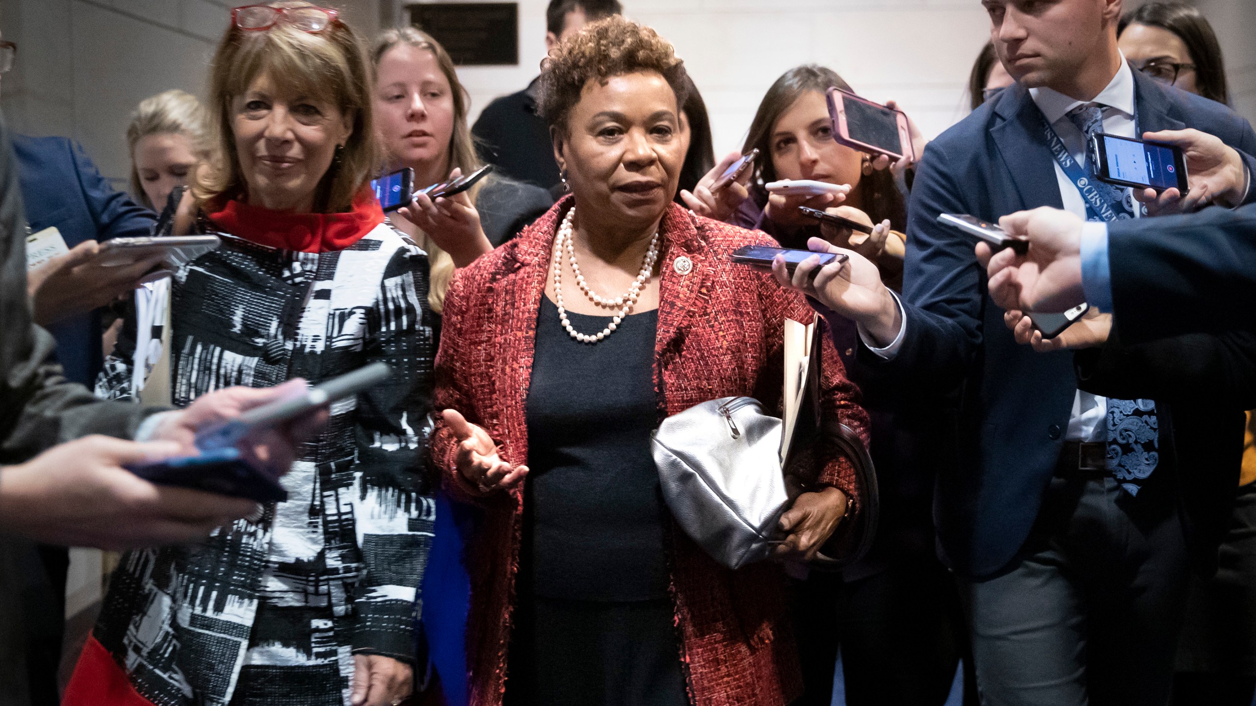 FILE—Rep. Barbara Lee, D-Calif., joined at left by Rep. Jackie Speier, D-Calif., is surrounded by reporters after she lost her bid for House Democratic Caucus chair to Rep. Hakeem Jeffries, D-N.Y., during leadership elections at the Capitol in Washington, Wednesday, Nov. 28, 2018. (AP Photo/J. Scott Applewhite, File)