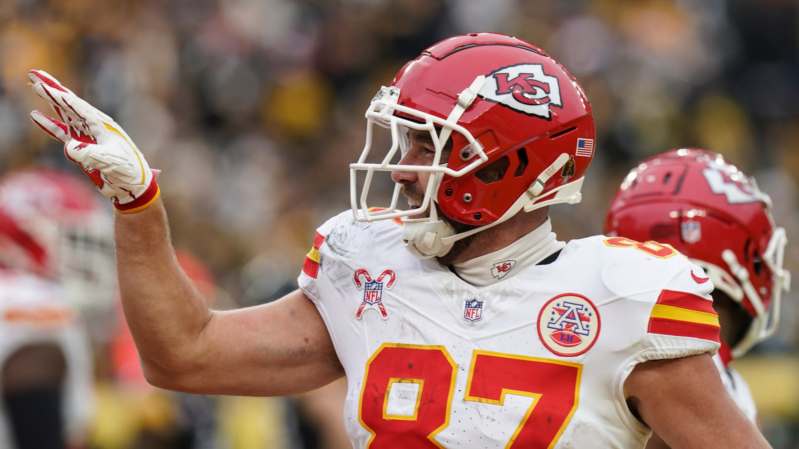 Kansas City Chiefs tight end Travis Kelce (87) celebrates his touchdown against the Pittsburgh Steelers during the second half of an NFL football game, Wednesday, Dec. 25, 2024, in Pittsburgh. (AP Photo/Matt Freed)