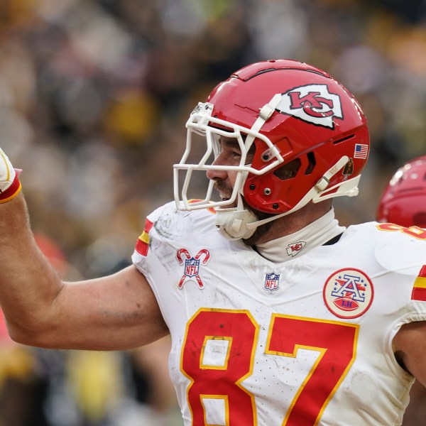 Kansas City Chiefs tight end Travis Kelce (87) celebrates his touchdown against the Pittsburgh Steelers during the second half of an NFL football game, Wednesday, Dec. 25, 2024, in Pittsburgh. (AP Photo/Matt Freed)