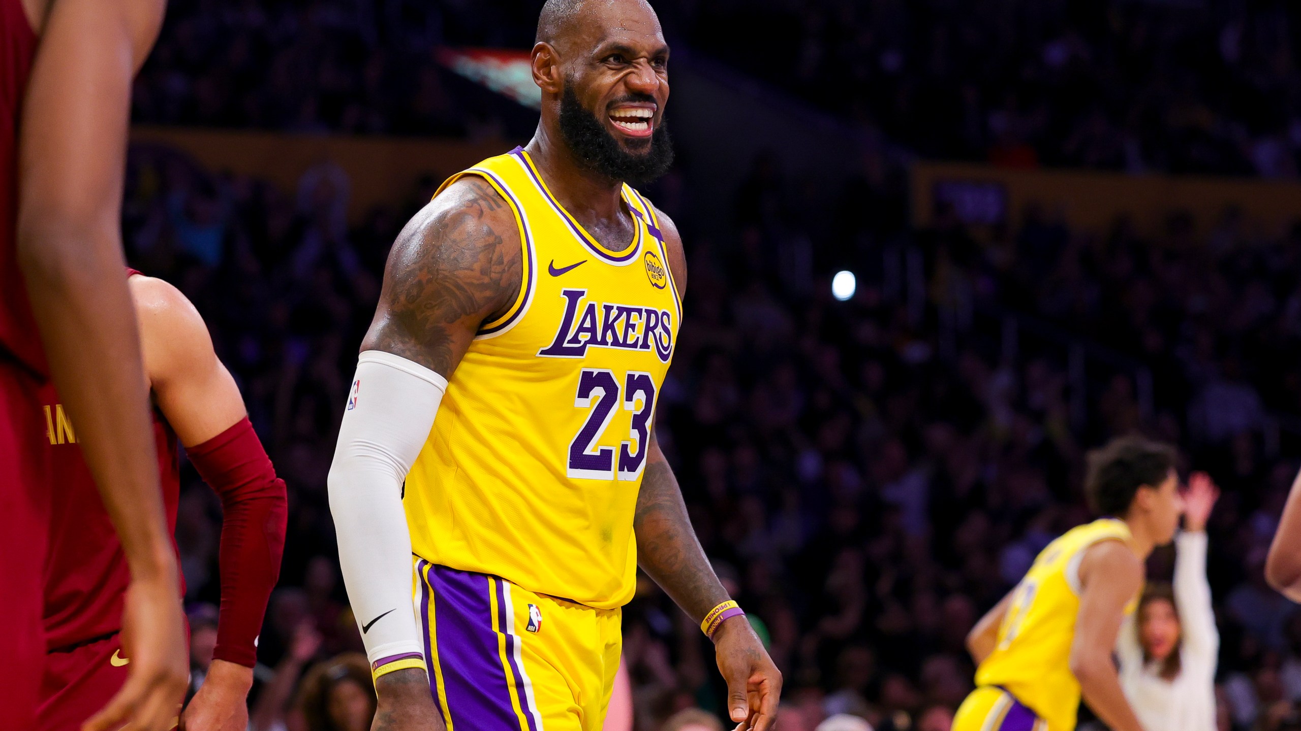 Los Angeles Lakers forward LeBron James celebrates after scoring during the second half of an NBA basketball game against the Cleveland Cavaliers Tuesday, Dec. 31, 2024, in Los Angeles. (AP Photo/Ryan Sun)