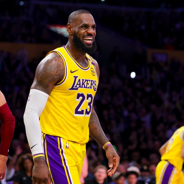 Los Angeles Lakers forward LeBron James celebrates after scoring during the second half of an NBA basketball game against the Cleveland Cavaliers Tuesday, Dec. 31, 2024, in Los Angeles. (AP Photo/Ryan Sun)