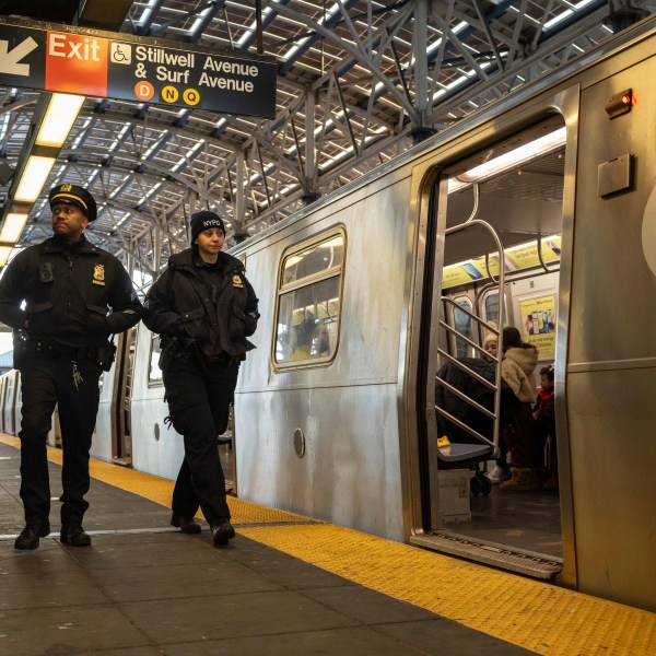 Police officers patrol the F train platform at the Coney Island-Stillwell Avenue Station, Thursday, Dec. 26, 2024, in New York. (AP Photo/Yuki Iwamura)