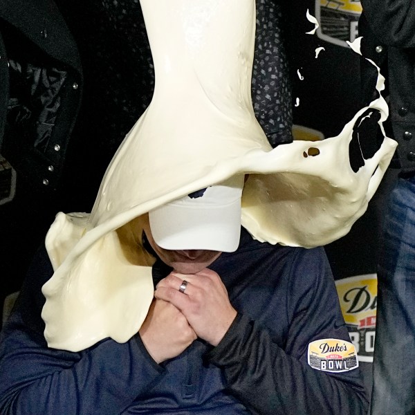 FILE - West Virginia head coach Neal Brown is dunked with mayonnaise after the team's win against North Carolina in an NCAA college football game at the Duke's Mayo Bowl Wednesday, Dec. 27, 2023, in Charlotte, N.C. (AP Photo/Chris Carlson, File)