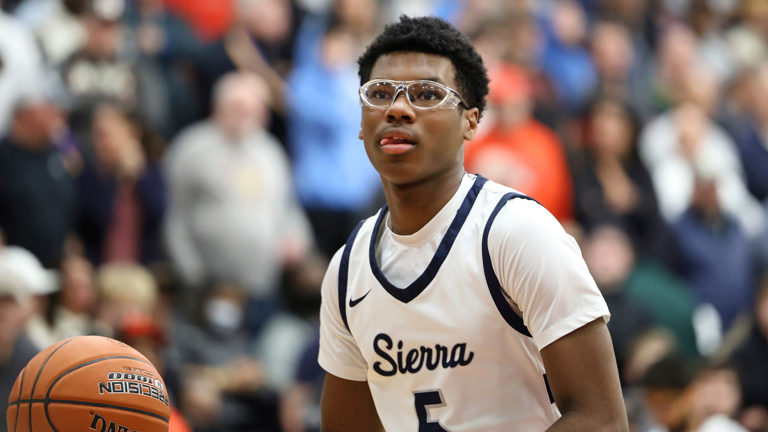 FILE - Sierra Canyon's Bryce James #5 warms up against Christopher Columbus at halftime during a high school basketball game at the Hoophall Classic, on January 16, 2023, in Springfield, MA. (AP Photo/Gregory Payan, File)