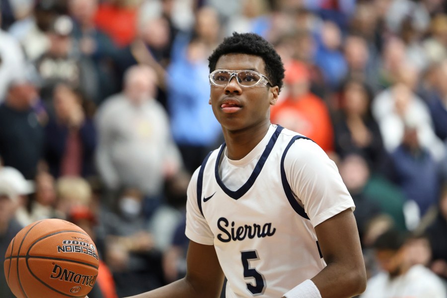 FILE - Sierra Canyon's Bryce James #5 warms up against Christopher Columbus at halftime during a high school basketball game at the Hoophall Classic, on January 16, 2023, in Springfield, MA. (AP Photo/Gregory Payan, File)