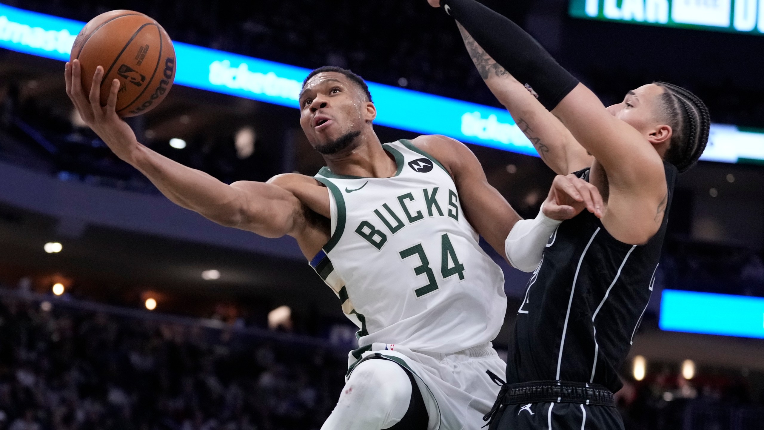 Milwaukee Bucks' Giannis Antetokounmpo shoots past Brooklyn Nets' Jalen Wilson during the second half of an NBA basketball game Thursday, Jan. 2, 2025, in Milwaukee. (AP Photo/Morry Gash)