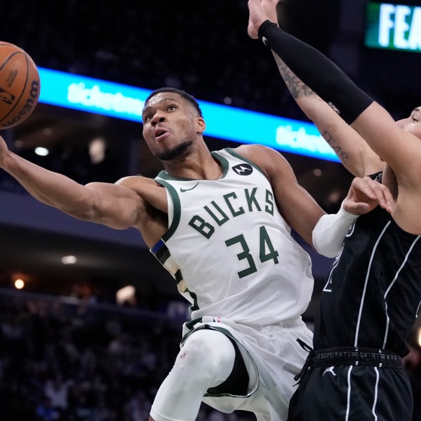 Milwaukee Bucks' Giannis Antetokounmpo shoots past Brooklyn Nets' Jalen Wilson during the second half of an NBA basketball game Thursday, Jan. 2, 2025, in Milwaukee. (AP Photo/Morry Gash)