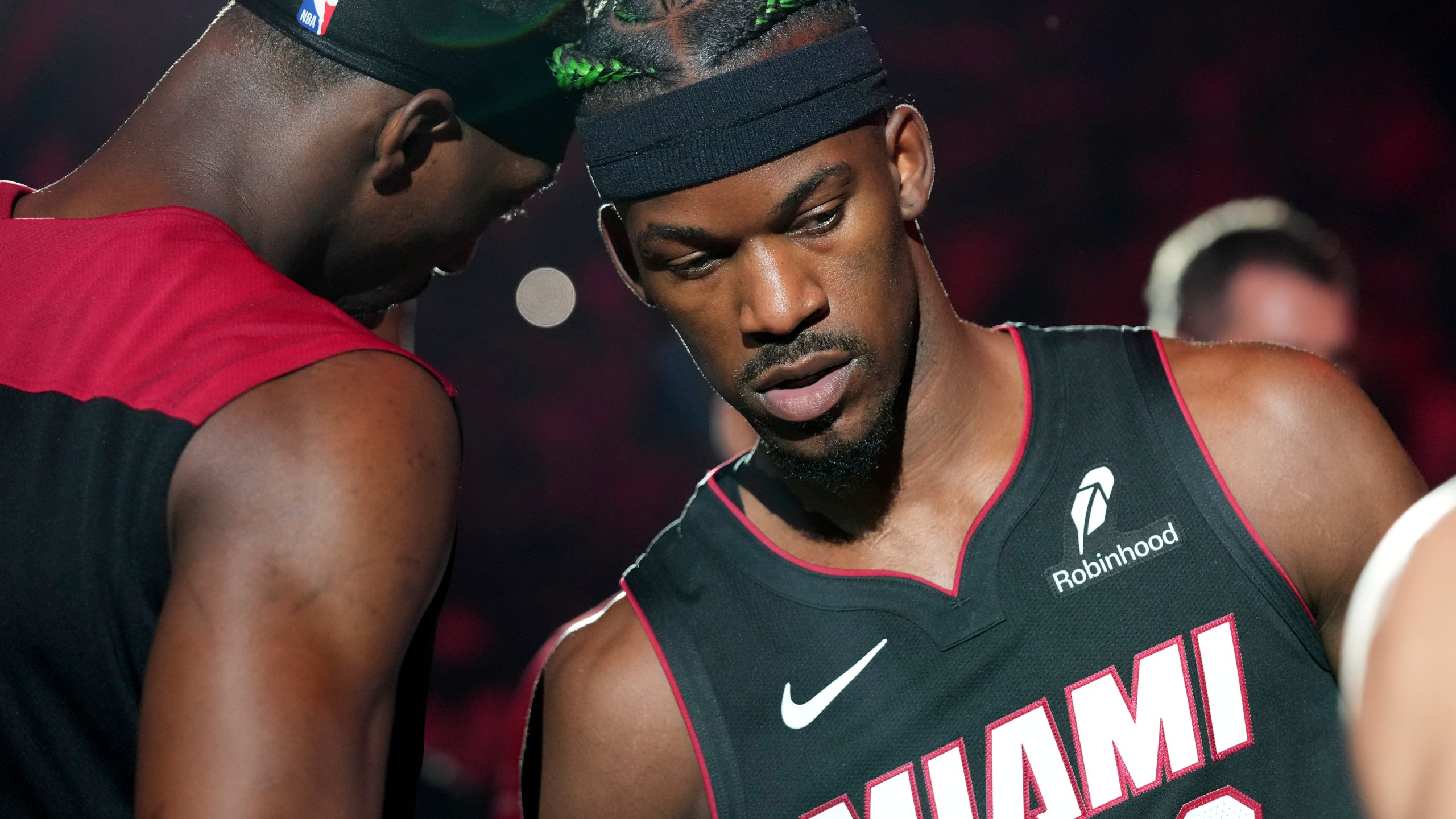 Miami Heat forward Jimmy Butler (22) and center Bam Adebayo, left, are introduced before an NBA basketball game against the Indiana Pacers Thursday, Jan. 2, 2025, in Miami. (AP Photo/Lynne Sladky)