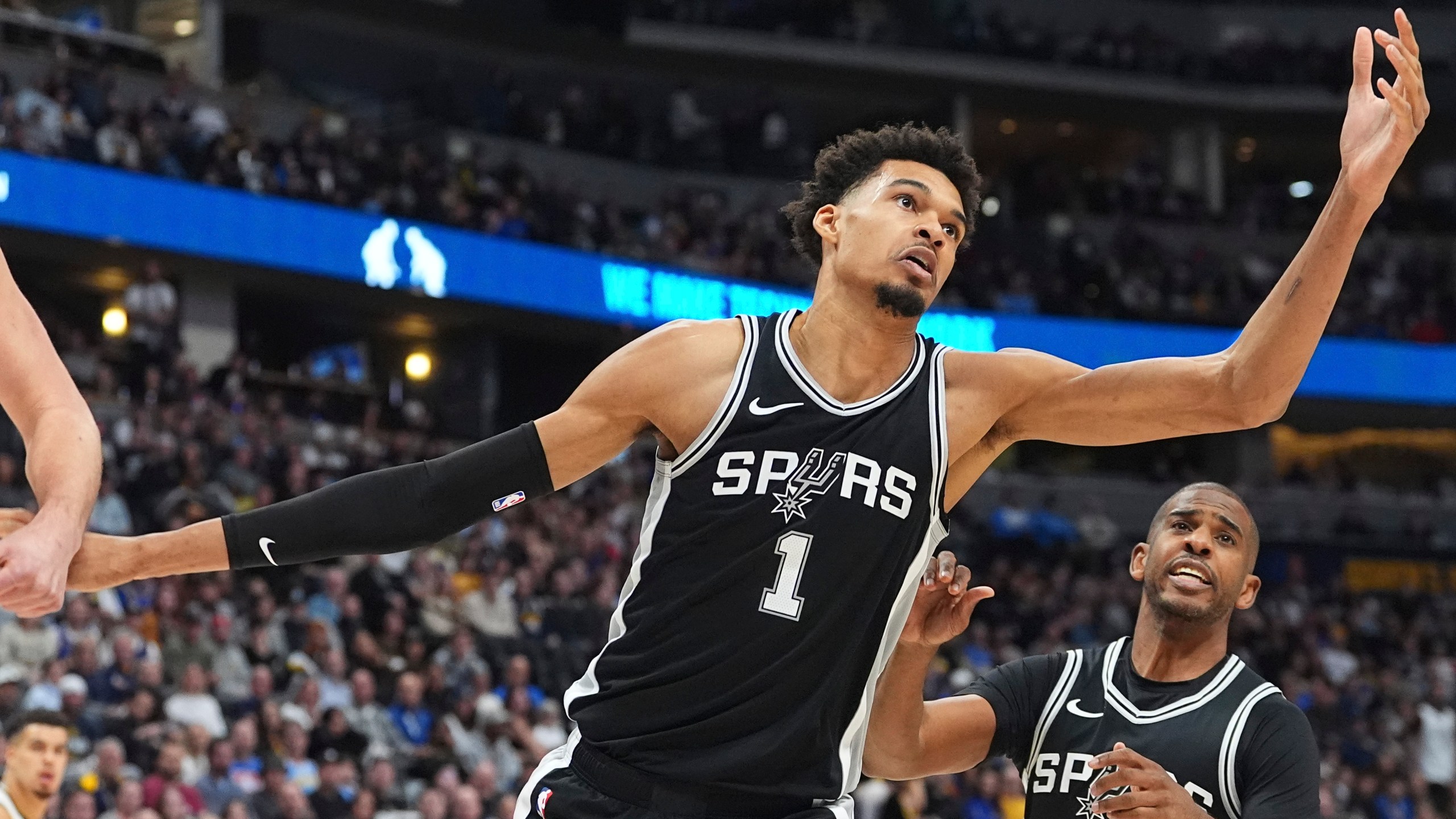 San Antonio Spurs center Victor Wembanyama pursues a rebound in the first half of an NBA basketball game against the Denver Nuggets Friday, Jan. 3, 2025, in Denver. (AP Photo/David Zalubowski)