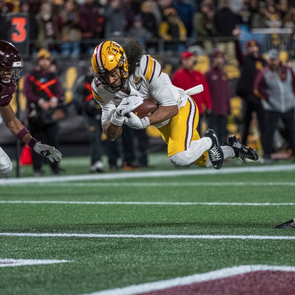 Minnesota wide receiver Elijah Spencer (11) dives in for a touchdown during the first half of the Duke's Mayo Bowl NCAA college football game Friday, Jan. 3, 2025, in Charlotte, N.C.(AP Photo/Robert Simmons)