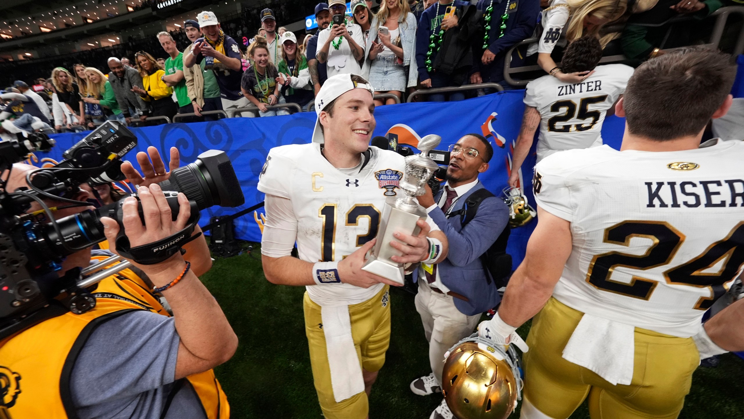 Notre Dame quarterback Riley Leonard (13) celebrates after a quarterfinal game against Georgia in a College Football Playoff, Thursday, Jan. 2, 2025, in New Orleans. (AP Photo/Gerald Herbert)