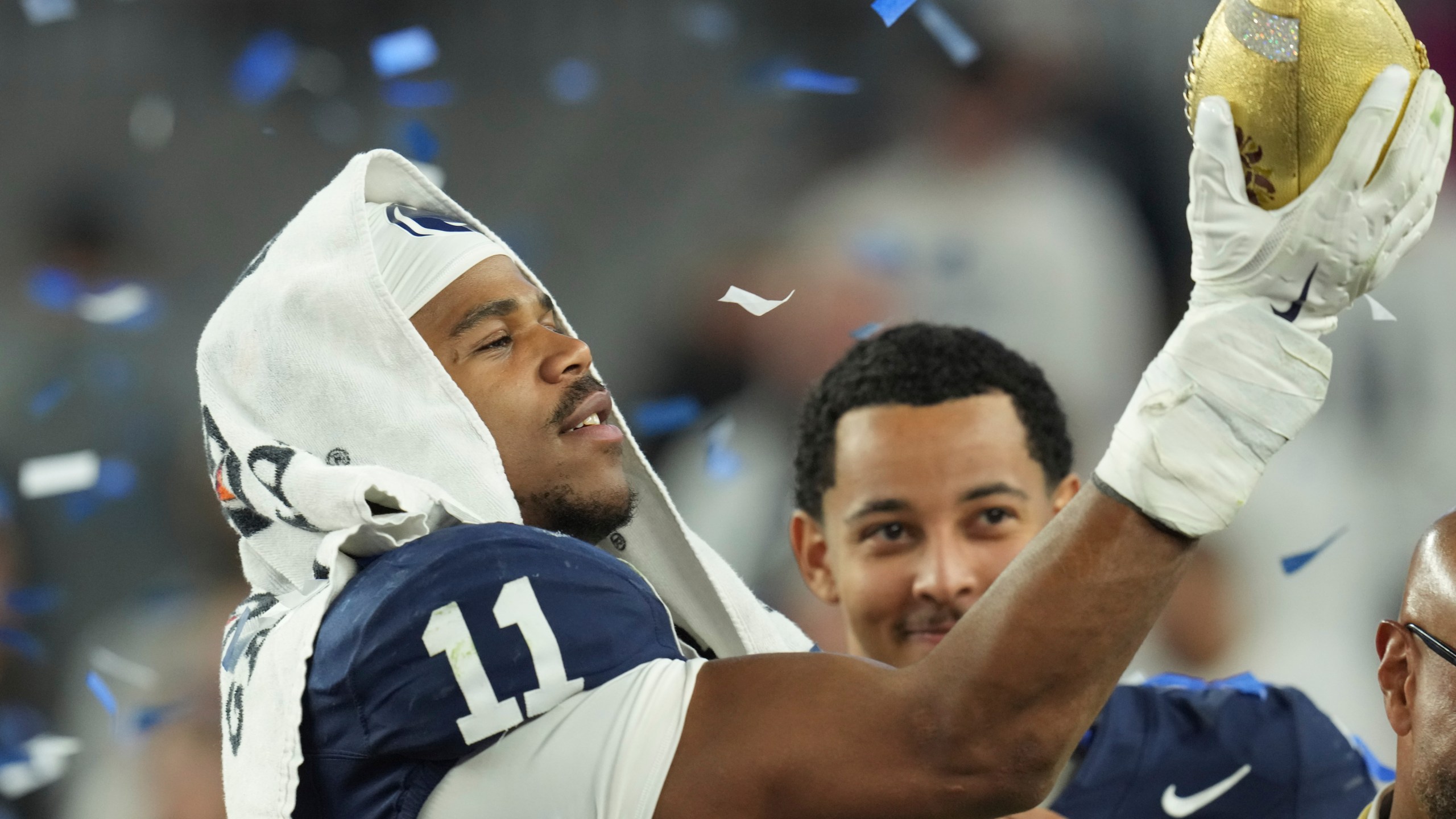 Penn State defensive end Abdul Carter (11) celebrates after the Fiesta Bowl College Football Playoff game against Boise State, Tuesday, Dec. 31, 2024, in Glendale, Ariz. (AP Photo/Ross D. Franklin)