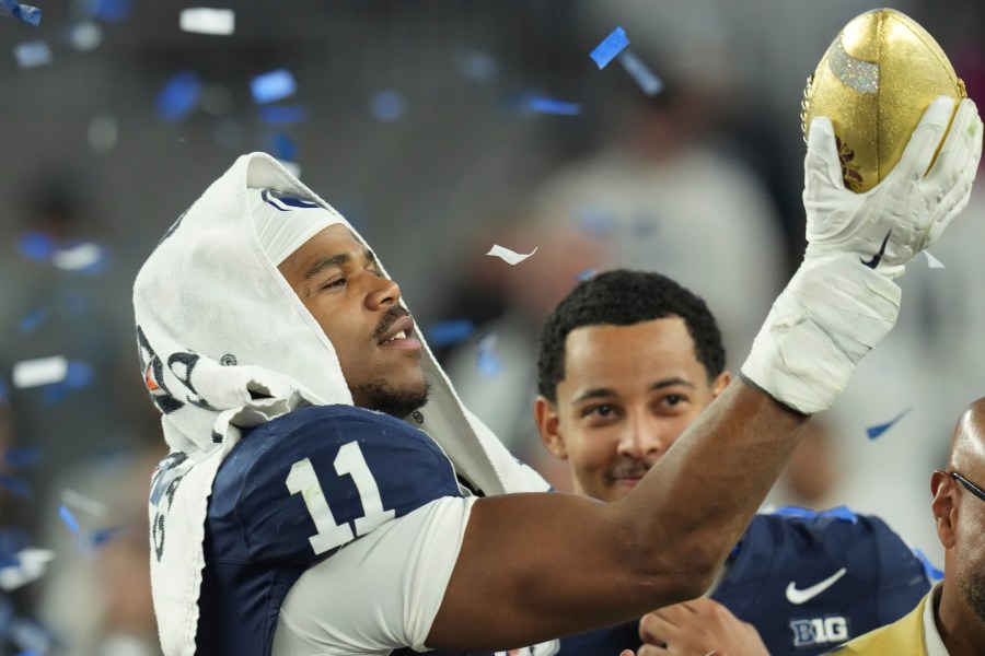 Penn State defensive end Abdul Carter (11) celebrates after the Fiesta Bowl College Football Playoff game against Boise State, Tuesday, Dec. 31, 2024, in Glendale, Ariz. (AP Photo/Ross D. Franklin)