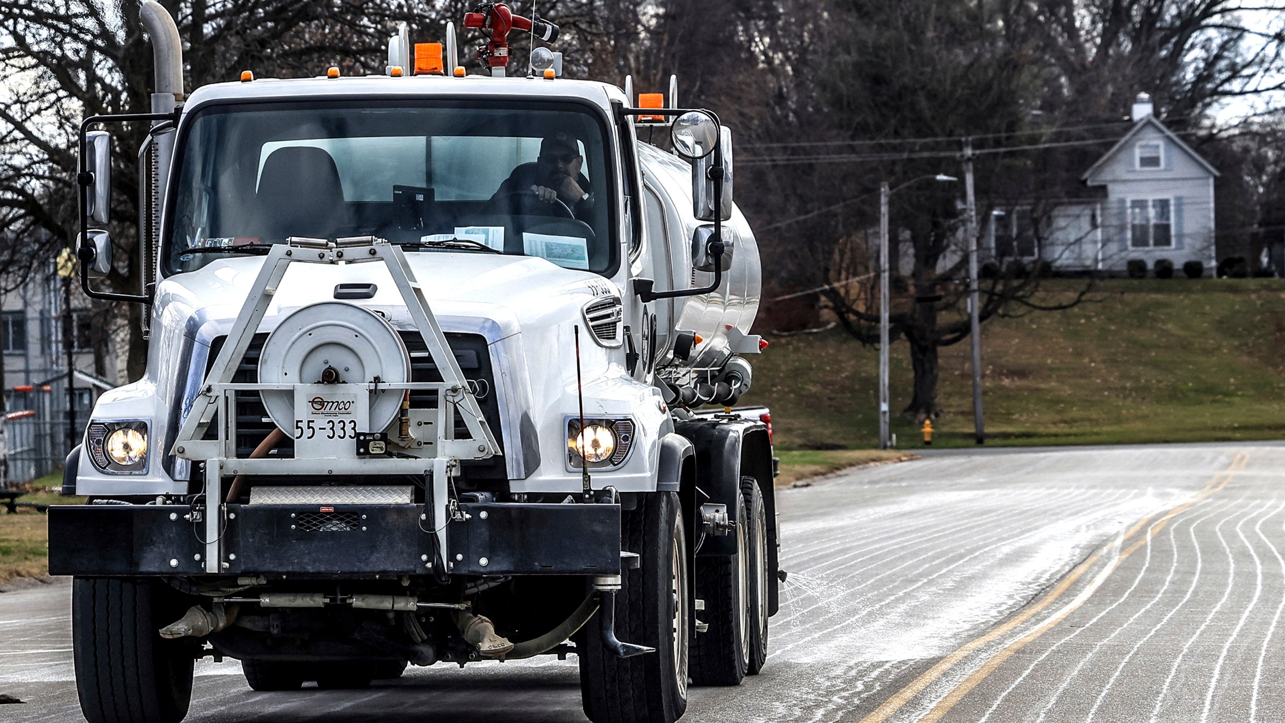 FILE - Steve Beckett with the street department in Owensboro, Ky., sprays a salt brine solution along Hickman Avenue in preparation for predicted snow and ice over the weekend, Friday, Jan. 3, 2025, in Owensboro, Ky. (Greg Eans/The Messenger-Inquirer via AP, File)