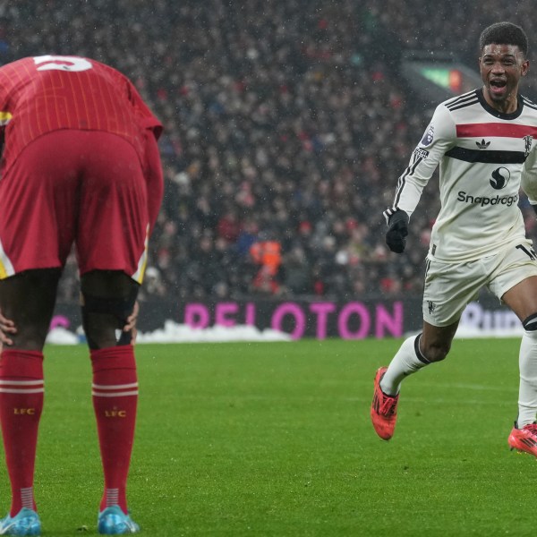 Manchester United's Amad Diallo celebrates after scoring his side's second goal against Liverpool during the English Premier League soccer match at the Anfield stadium in Liverpool, England, Sunday, Jan. 5, 2025. (AP Photo/Jon Super)