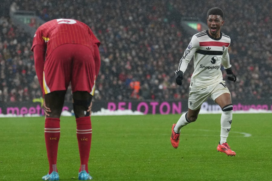 Manchester United's Amad Diallo celebrates after scoring his side's second goal against Liverpool during the English Premier League soccer match at the Anfield stadium in Liverpool, England, Sunday, Jan. 5, 2025. (AP Photo/Jon Super)