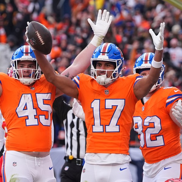 Denver Broncos wide receiver Devaughn Vele (17) celebrates after catching a touchdown pass during the first half of an NFL football game against the Kansas City Chiefs Sunday, Jan. 5, 2025, in Denver. (AP Photo/David Zalubowski)