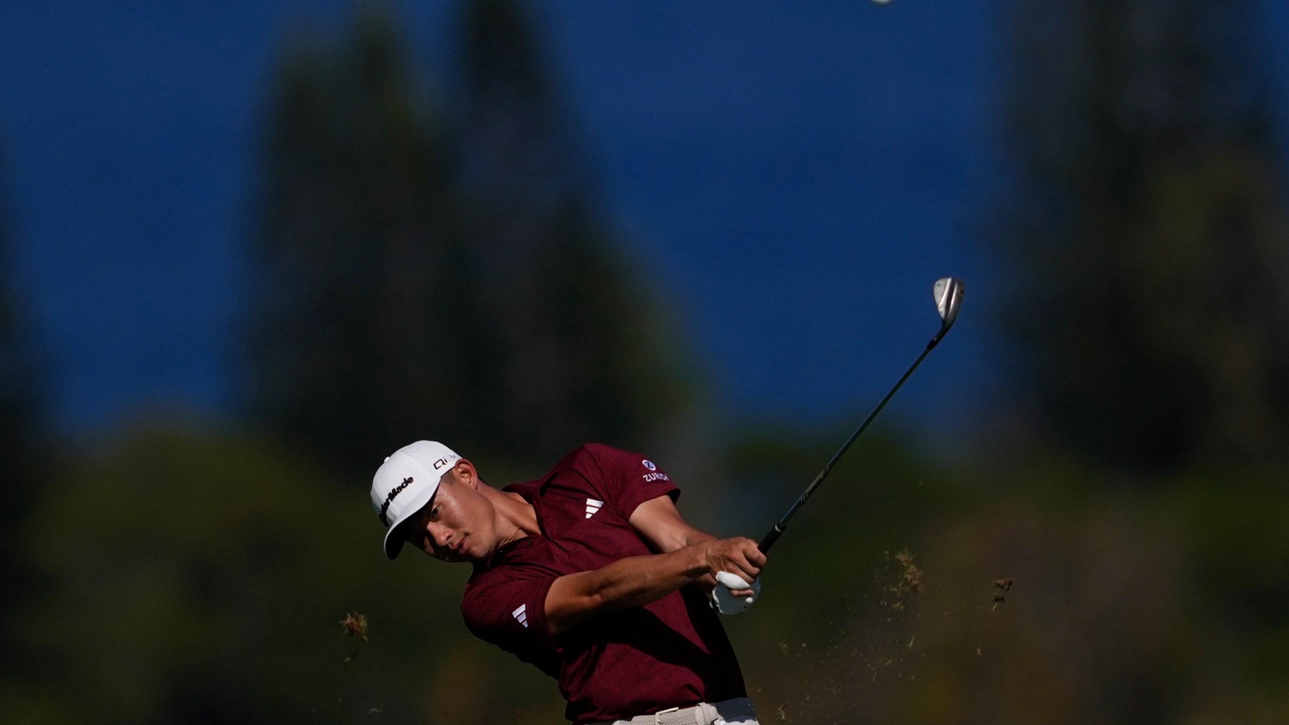 Collin Morikawa watches his shot on the fourth hole during the final round of The Sentry golf event, Sunday, Jan. 5, 2025, at Kapalua Plantation Course in Kapalua, Hawaii. (AP Photo/Matt York)