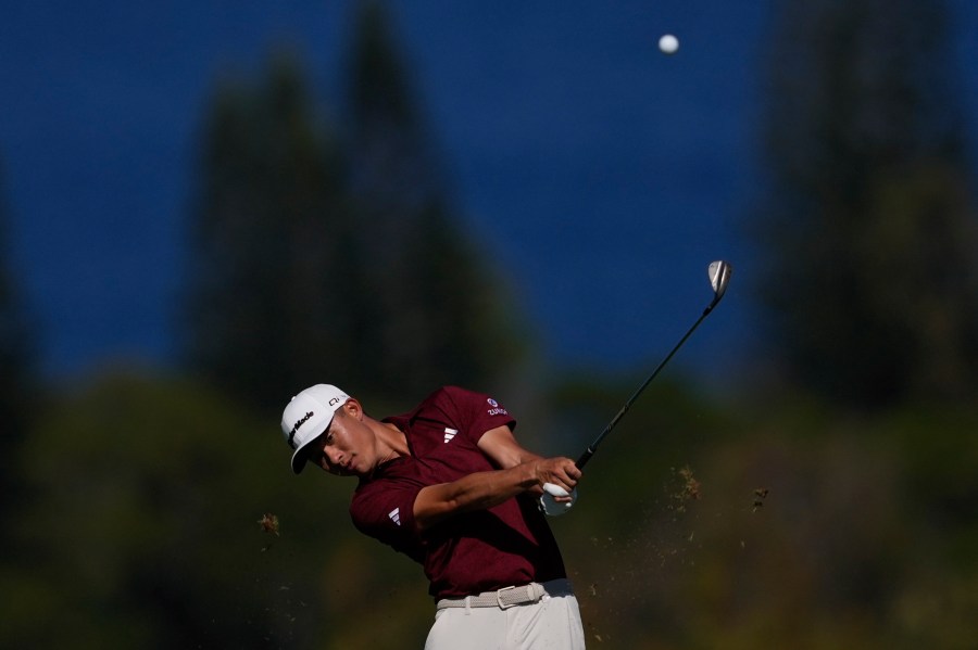 Collin Morikawa watches his shot on the fourth hole during the final round of The Sentry golf event, Sunday, Jan. 5, 2025, at Kapalua Plantation Course in Kapalua, Hawaii. (AP Photo/Matt York)