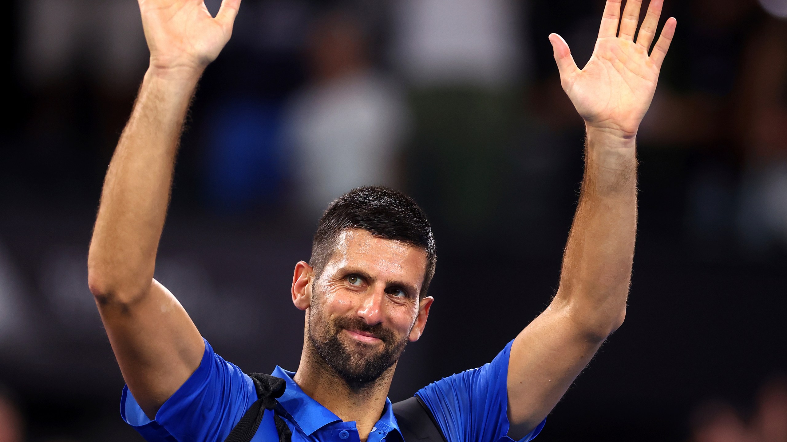 Serbia's Novak Djokovic reacts after losing his match against USA's Reilly Opelka at the Brisbane International, in Brisbane, Australia, Friday, Jan. 3, 2025. (AP Photo/Pat Hoelscher)