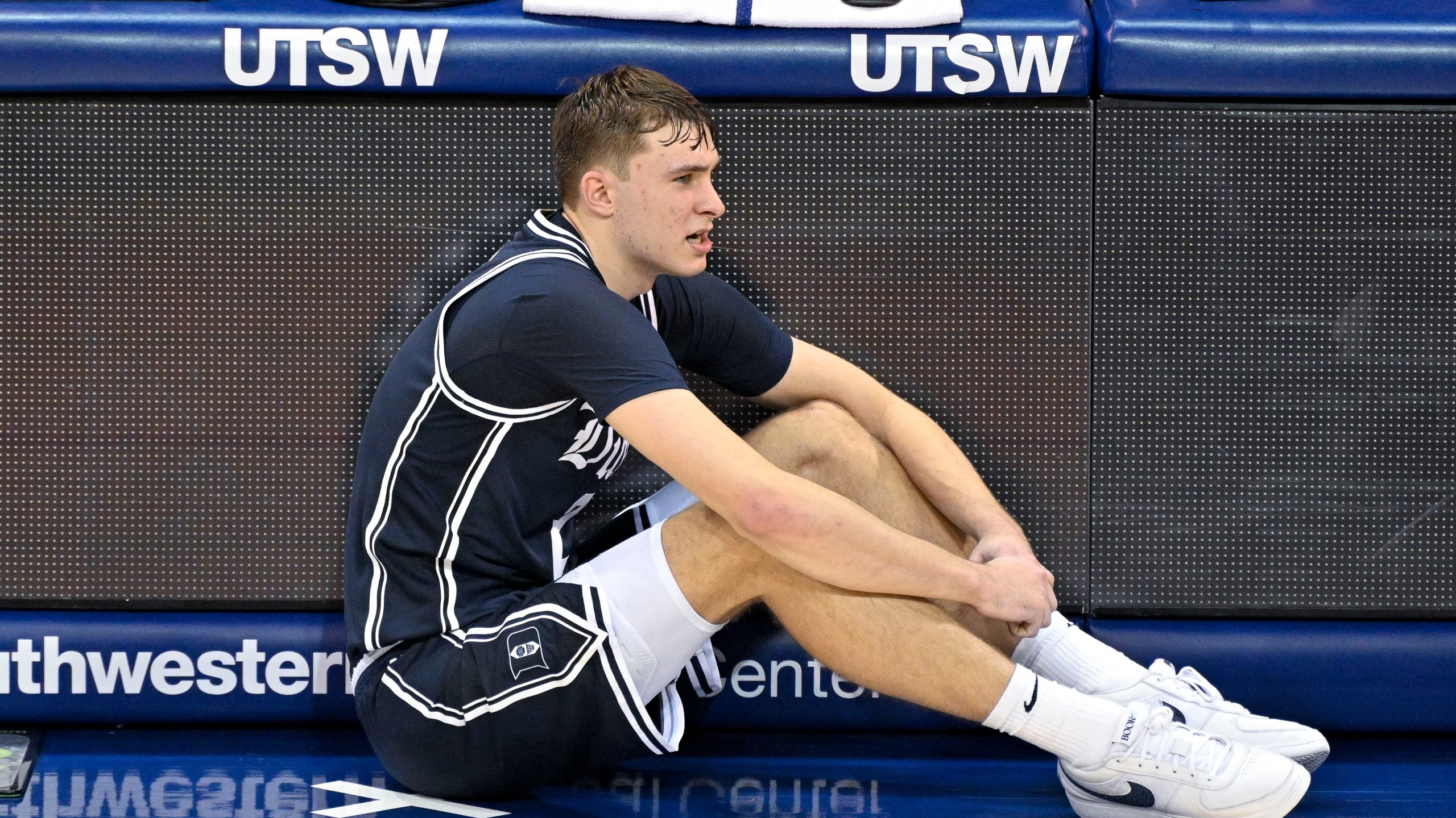 Duke guard Cooper Flagg (2) sits on the floor as he waits to enter an NCAA college basketball game against SMU during the second half Saturday, Jan. 4, 2025, in Dallas. Duke wins 89-62. (AP Photo/Jerome Miron)