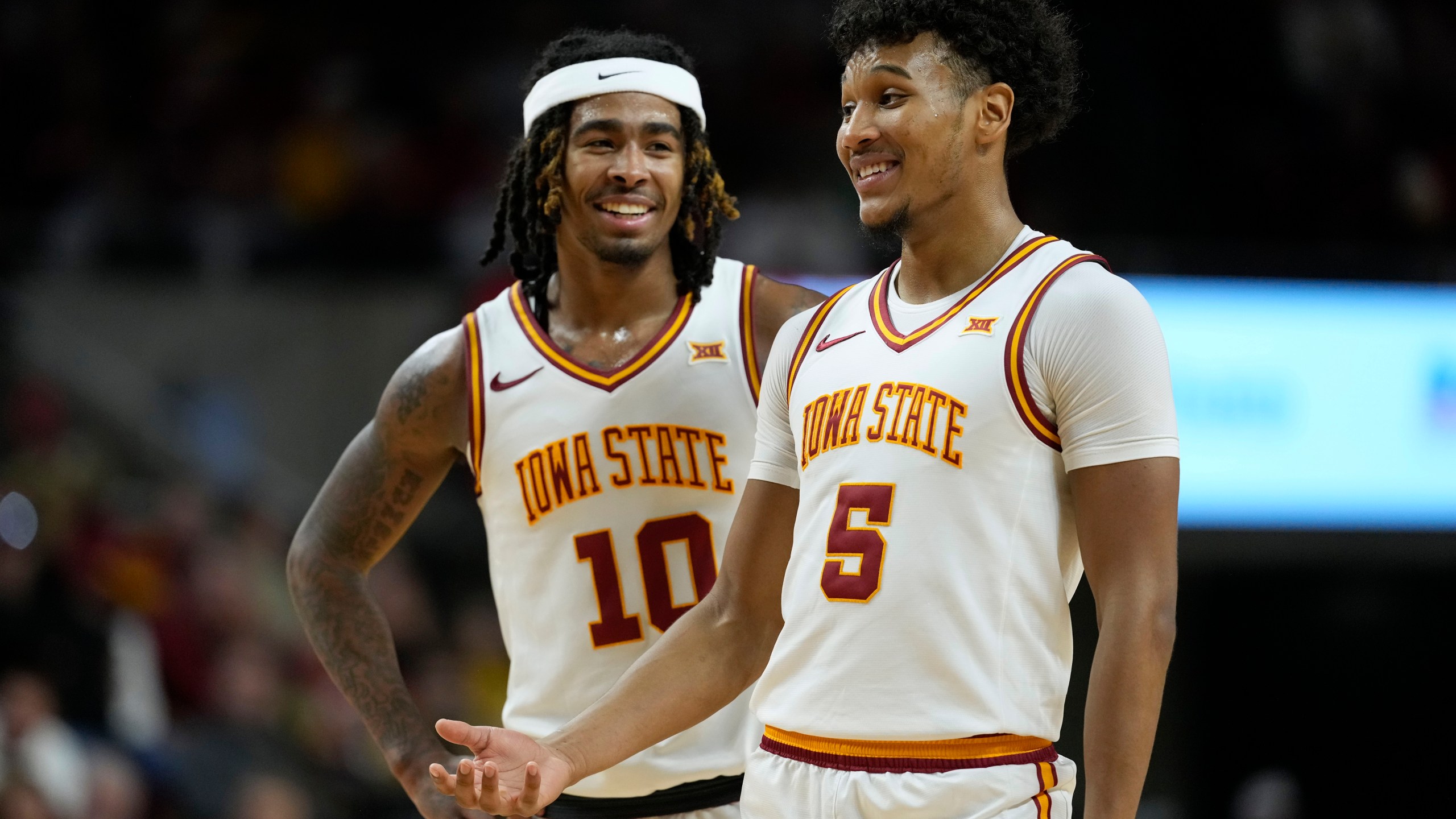 Iowa State guard Curtis Jones (5) talks with teammate guard Keshon Gilbert (10) during the second half of an NCAA college basketball game against Baylor Saturday, Jan. 4, 2025, in Ames, Iowa. (AP Photo/Charlie Neibergall)