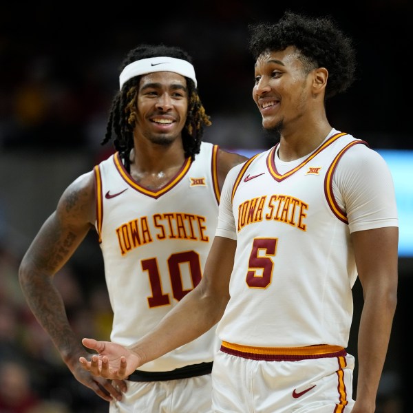 Iowa State guard Curtis Jones (5) talks with teammate guard Keshon Gilbert (10) during the second half of an NCAA college basketball game against Baylor Saturday, Jan. 4, 2025, in Ames, Iowa. (AP Photo/Charlie Neibergall)