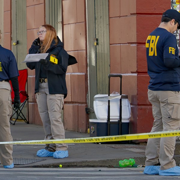 The FBI and a bomb squad earlier detonated a suspicious package found in this cooler at Bourbon St and Orleans Street in the French Quarter during the investigation of truck crashing into pedestrians followed by shooting on Bourbon Street in the French Quarter in New Orleans, Wednesday, Jan. 1, 2025. (AP Photo/Matthew Hinton)