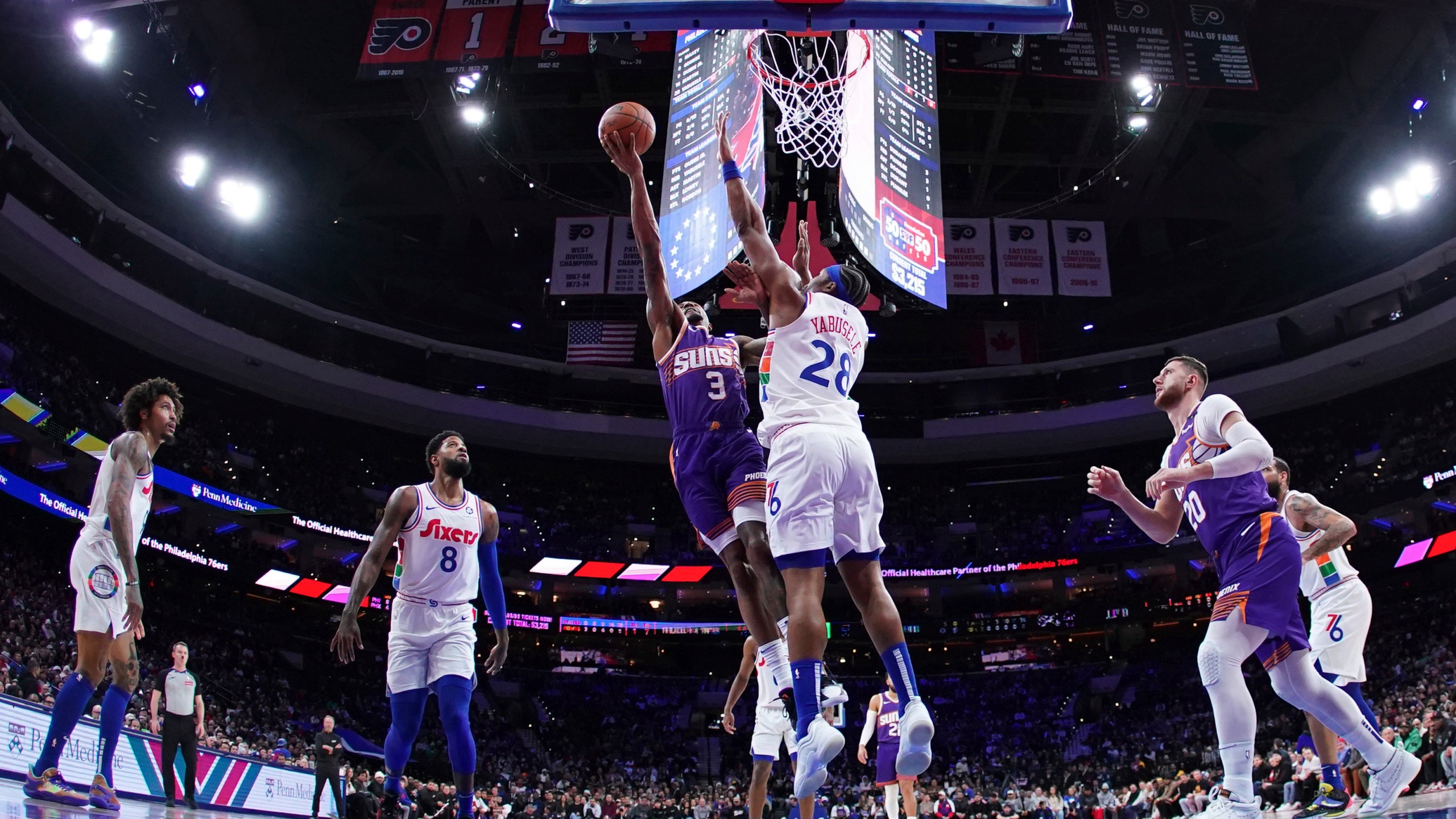 Phoenix Suns' Bradley Beal (3) goes up for a shot against Philadelphia 76ers' Guerschon Yabusele (28) during the first half of an NBA basketball game, Monday, Jan. 6, 2025, in Philadelphia. (AP Photo/Matt Slocum)