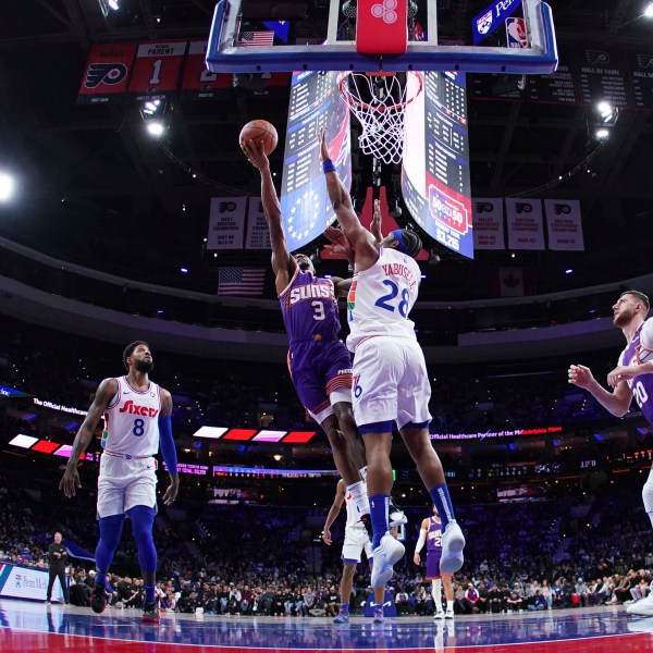 Phoenix Suns' Bradley Beal (3) goes up for a shot against Philadelphia 76ers' Guerschon Yabusele (28) during the first half of an NBA basketball game, Monday, Jan. 6, 2025, in Philadelphia. (AP Photo/Matt Slocum)