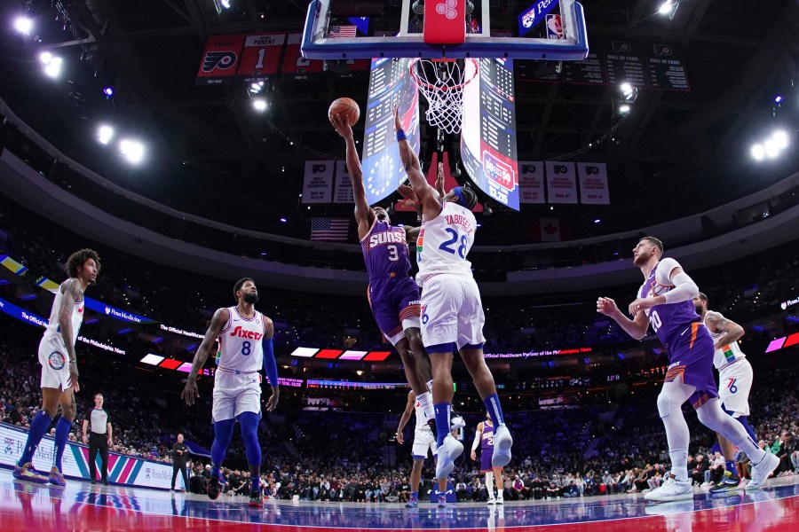 Phoenix Suns' Bradley Beal (3) goes up for a shot against Philadelphia 76ers' Guerschon Yabusele (28) during the first half of an NBA basketball game, Monday, Jan. 6, 2025, in Philadelphia. (AP Photo/Matt Slocum)