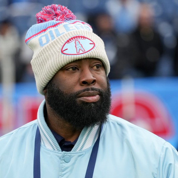 Tennessee Titans general manager Ran Carthon watches the team warm up before an NFL football game against the Houston Texans, Sunday, Jan. 5, 2025, in Nashville, Tenn. (AP Photo/George Walker IV)