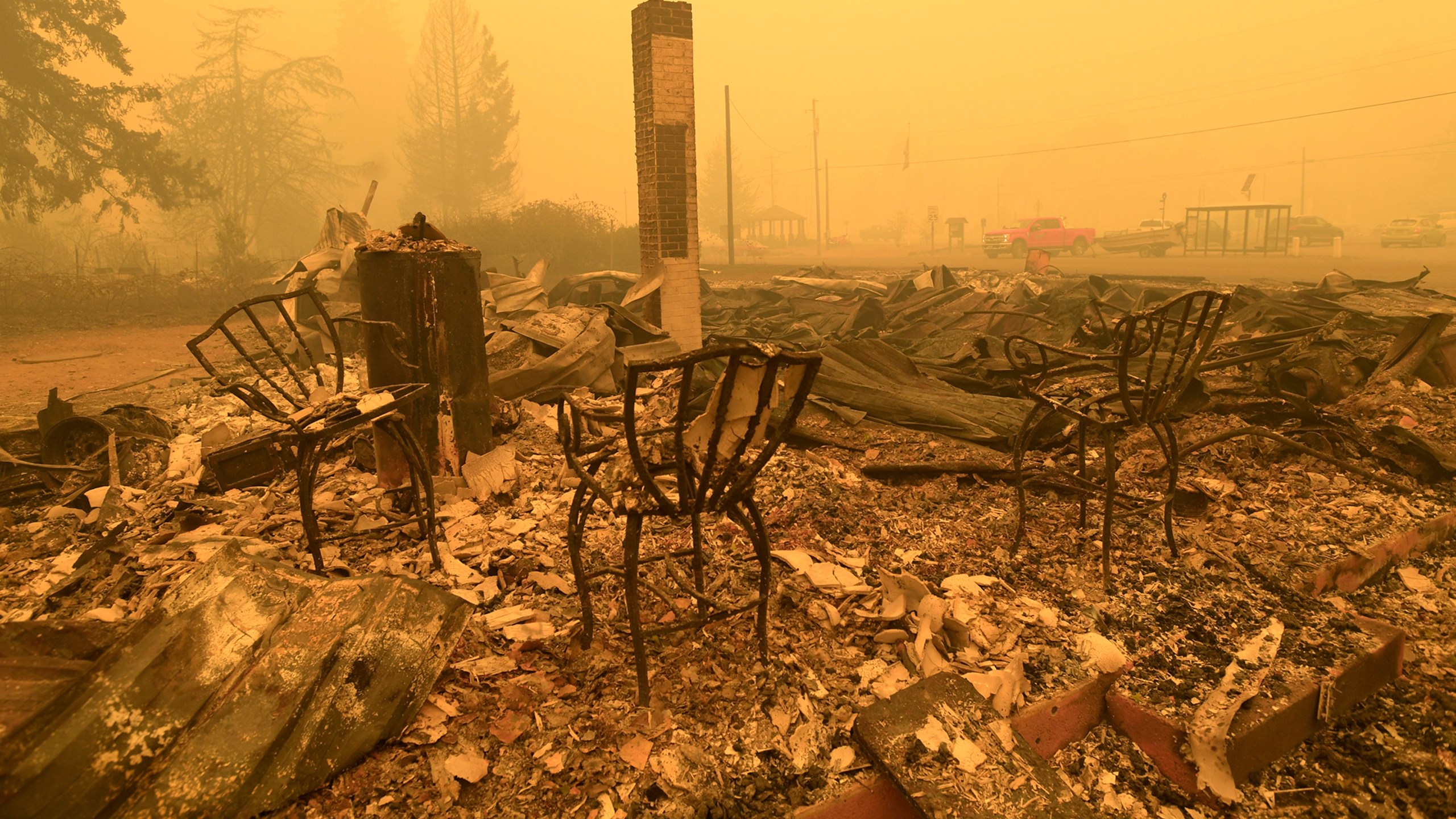 FILE - Chairs stand at a post office in the aftermath of the Santiam Fire in Gates, Ore., Sept 9, 2020. (Mark Ylen/Albany Democrat-Herald via AP, File)