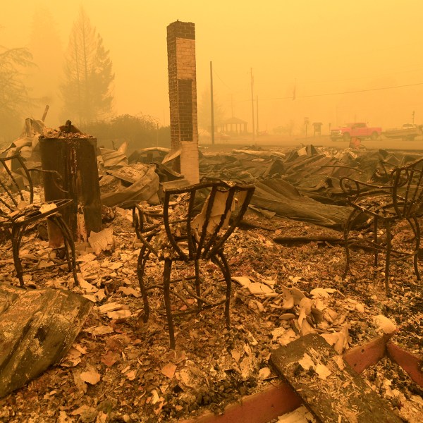 FILE - Chairs stand at a post office in the aftermath of the Santiam Fire in Gates, Ore., Sept 9, 2020. (Mark Ylen/Albany Democrat-Herald via AP, File)