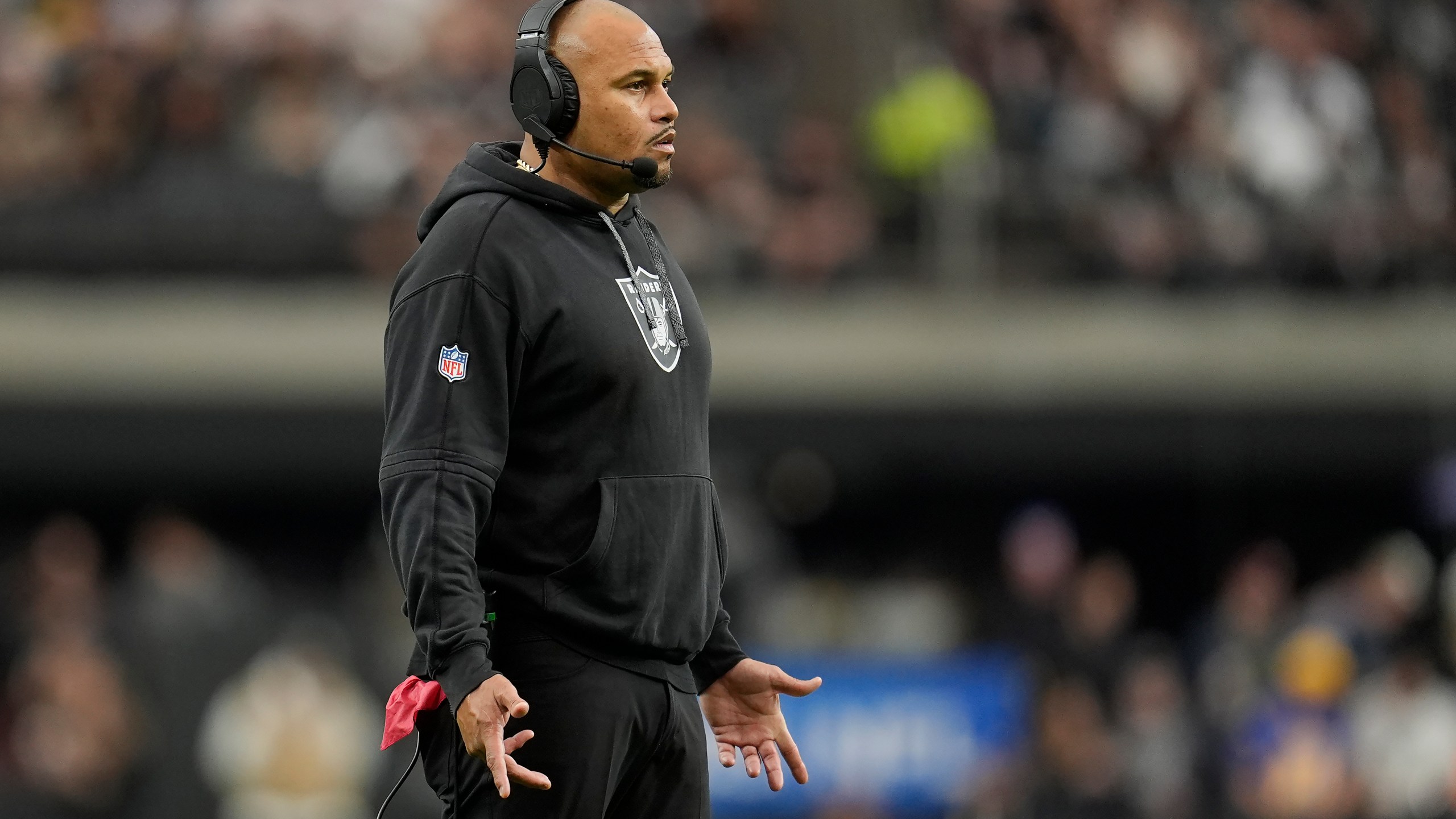 Las Vegas Raiders head coach Antonio Pierce reacts during the first half of an NFL football game against the Los Angeles Chargers in Las Vegas, Sunday, Jan. 5, 2025. (AP Photo/Abbie Parr)