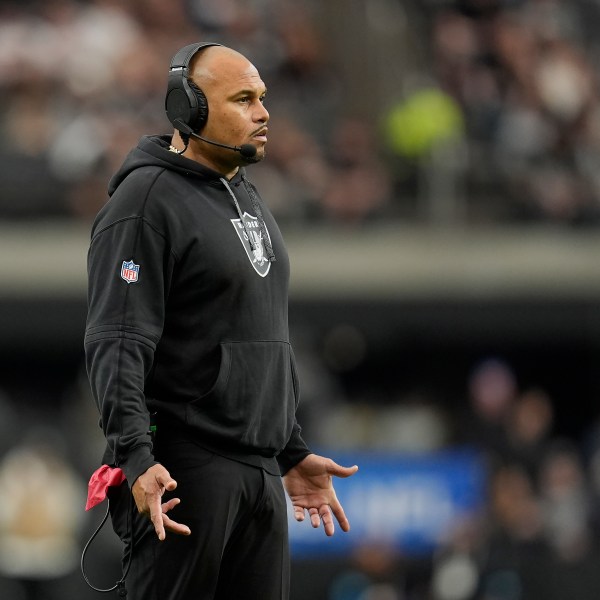 Las Vegas Raiders head coach Antonio Pierce reacts during the first half of an NFL football game against the Los Angeles Chargers in Las Vegas, Sunday, Jan. 5, 2025. (AP Photo/Abbie Parr)