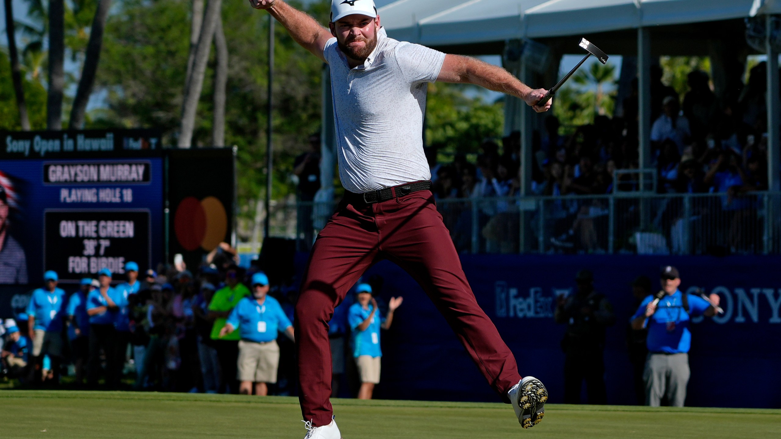 FILE - Grayson Murray celebrates winning the Sony Open golf event, Sunday, Jan. 14, 2024, at Waialae Country Club in Honolulu. (AP Photo/Matt York, File)