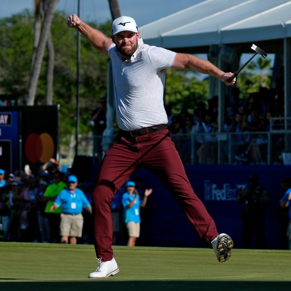 FILE - Grayson Murray celebrates winning the Sony Open golf event, Sunday, Jan. 14, 2024, at Waialae Country Club in Honolulu. (AP Photo/Matt York, File)