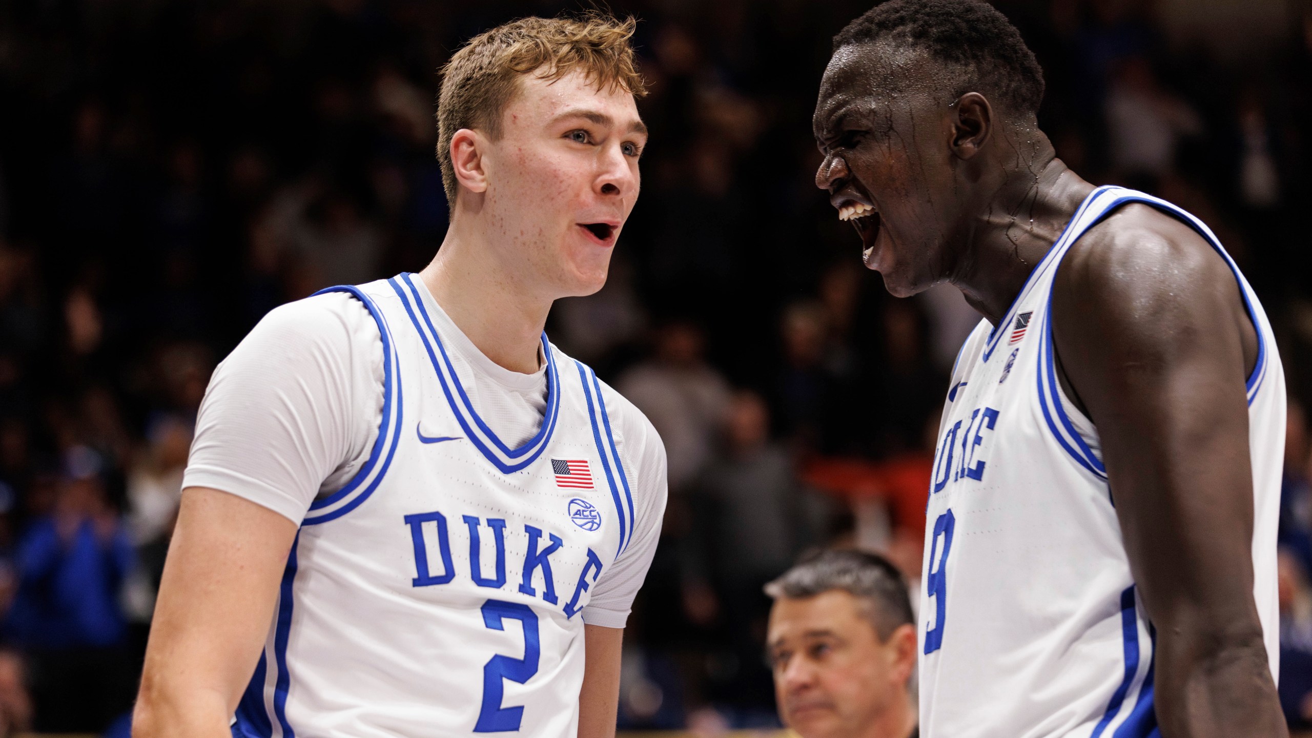 Duke's Cooper Flagg (2) reacts with Khaman Malauch (9) after a dunk during the second half of an NCAA college basketball game agaist Pittsburgh in Durham, N.C., Tuesday, Jan. 7, 2025. (AP Photo/Ben McKeown)