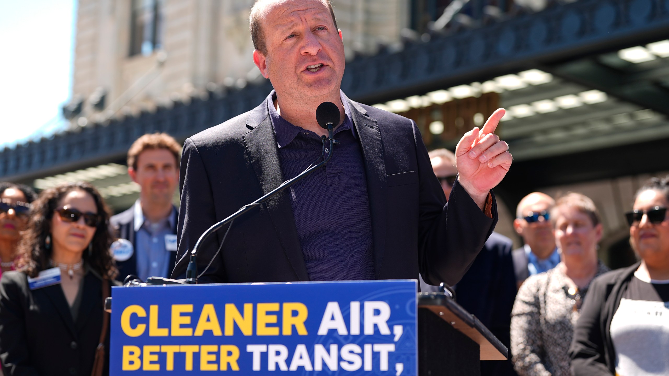 FILE - Colorado Gov. Jared Polis speaks before signing into law a surface transportation infrastructure development bill to help connect the state with a passenger rail system during a ceremony May 16, 2024, in front of Union Station in lower downtown Denver. (AP Photo/David Zalubowski, File)