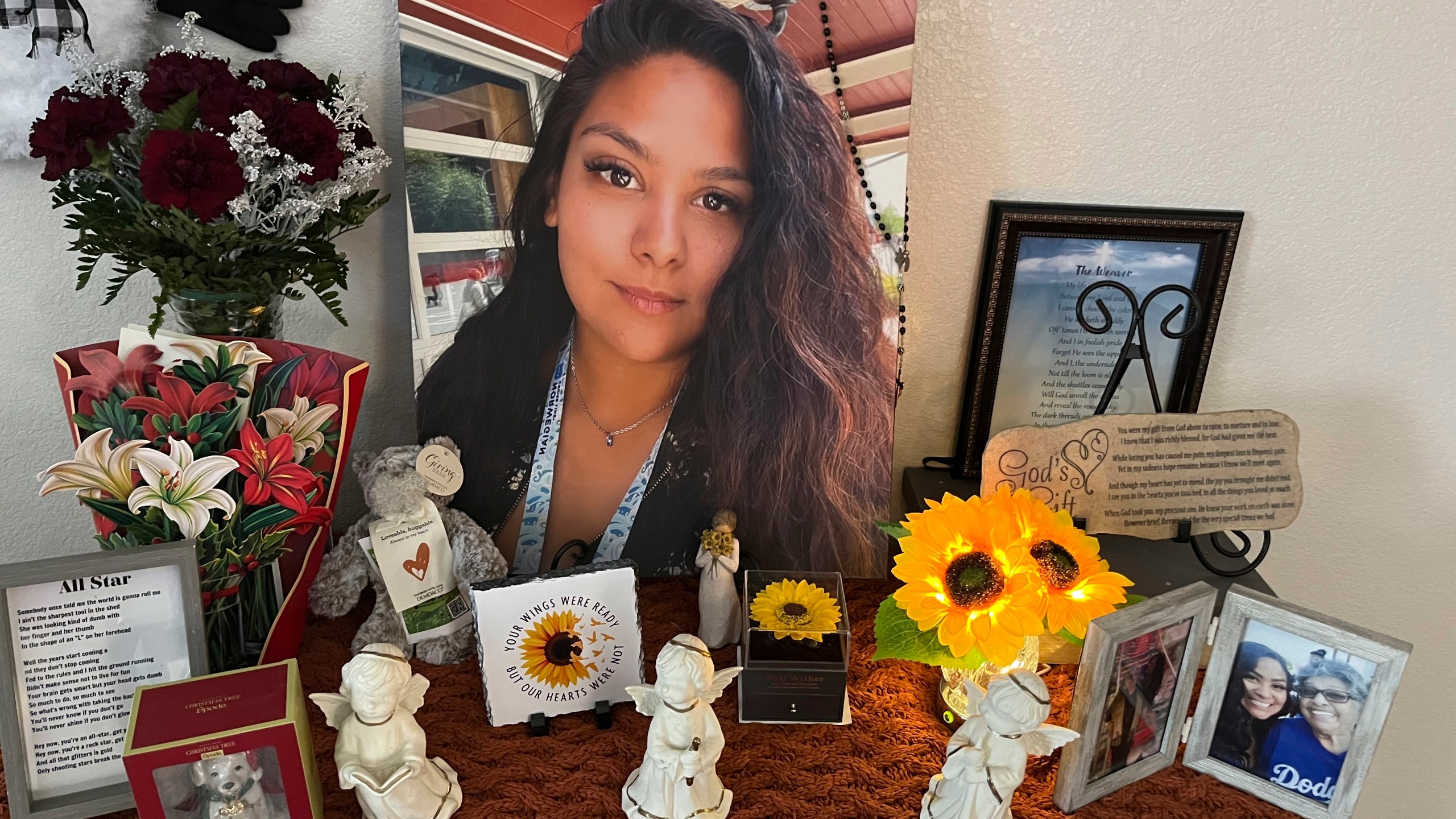 A photograph of Stephanie Cosme sits on an altar on Dec. 22, 2023, in Palmdale, Calif. (Paula Zamorano via AP)